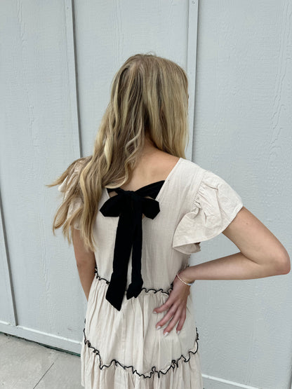 CODI BABYDOLL NATURAL AND BLACK BOW DRESS BY IVY & CO